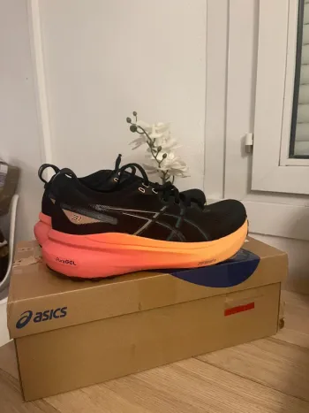 Used Orange ASICS Gel-Kayano 31 bike