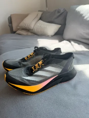 Orange Adizero Boston 12 bike d'occasion