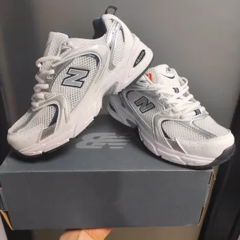 Brugt White and blue running shoes bike