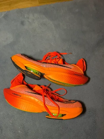 Used Orange Nike Laufschuhe bike