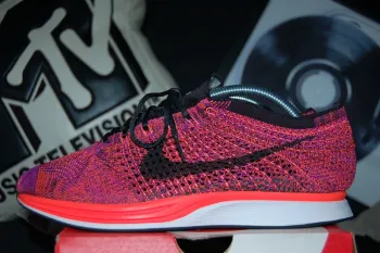 Used Orange Flyknit Racer Running Shoes