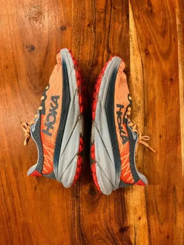 Used Orange Hoka Running Shoes bike — image 1 of 6