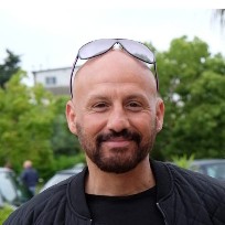 AT